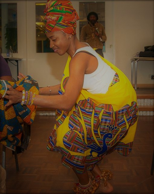 Nyanga in colourful Maroon clothing during a dance session